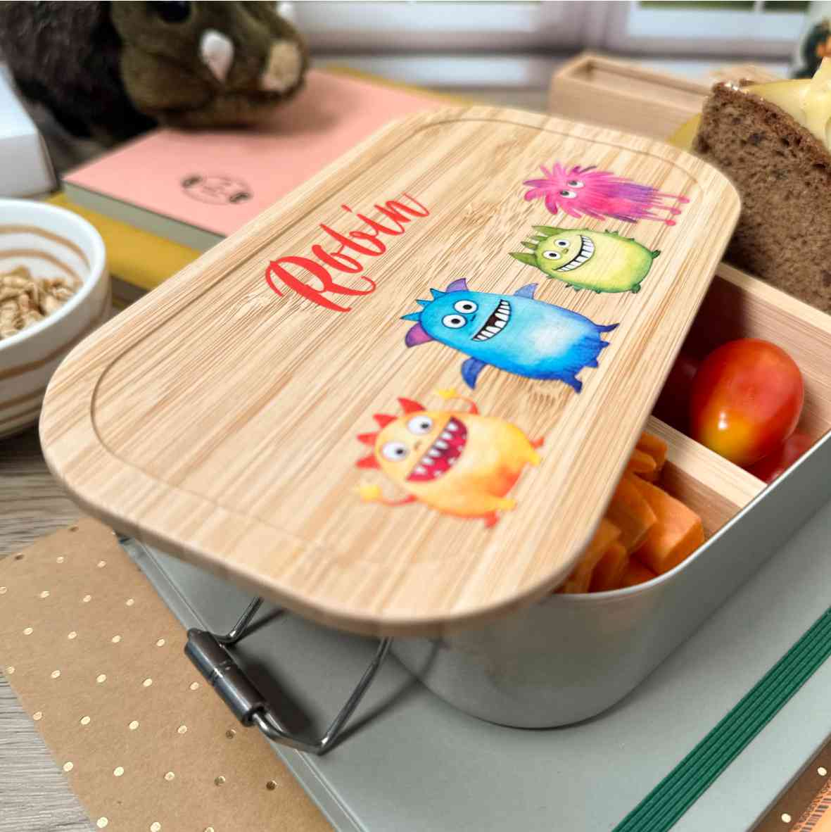 Brotdose mit bunten Monstern und Namensdruck